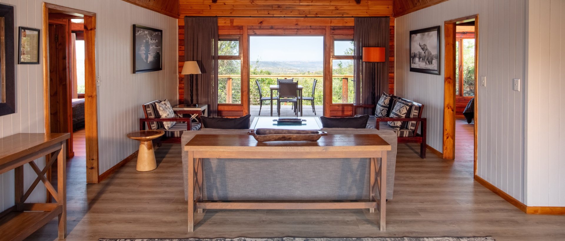 The lounge inside a log chalet at Kariega Main Lodge
