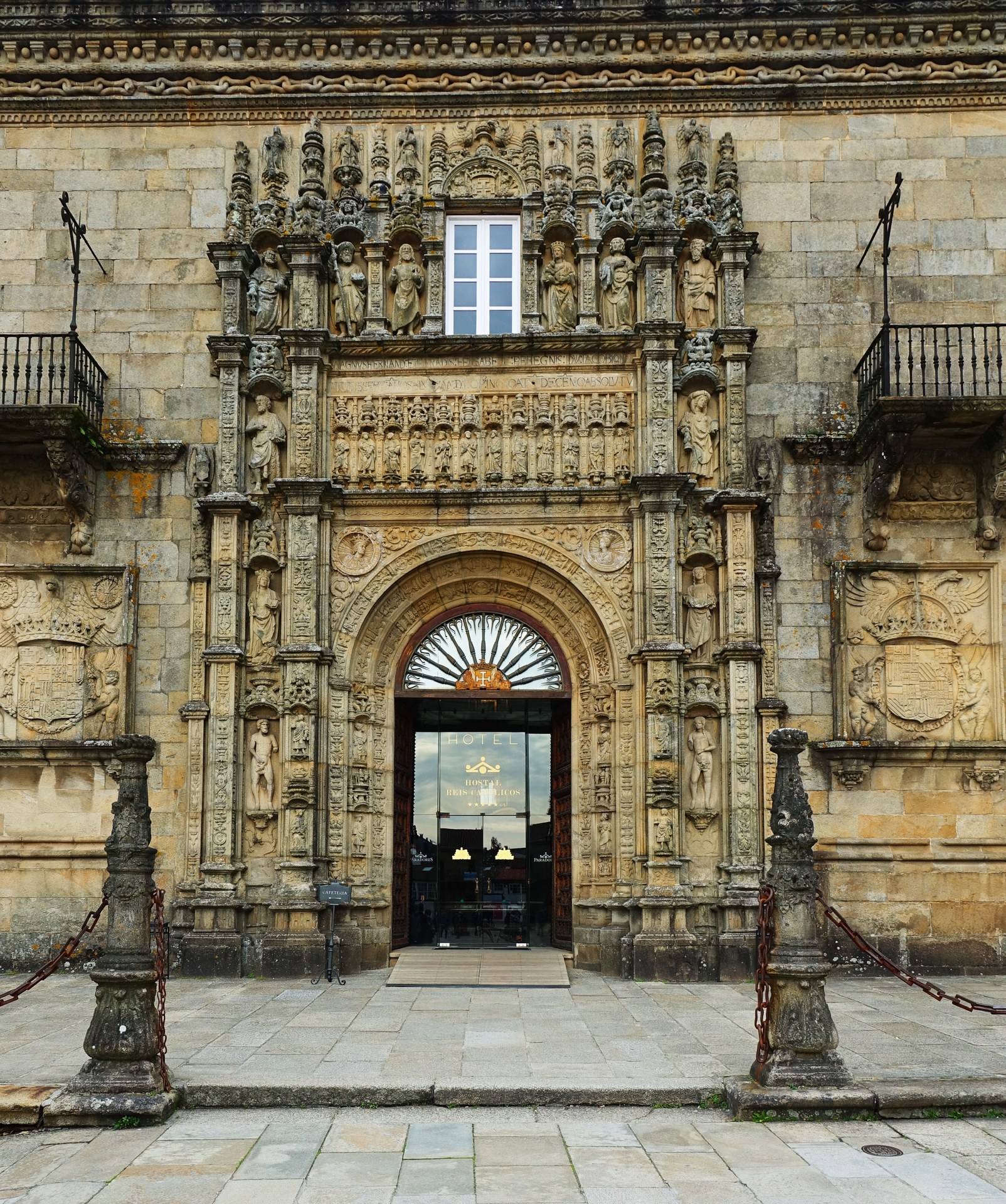 The carved main entrance to the Hostal dos Reis Católicos on the Praza do Obradoiro in Santiago de Compostela
