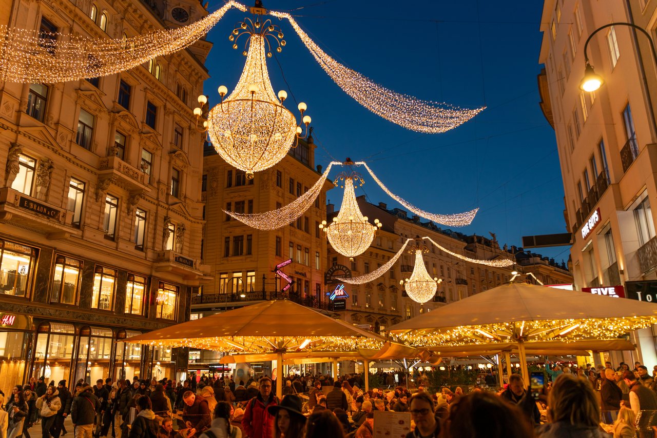 Christmas lights strung over a pedestrian shopping street in Vienna's old town